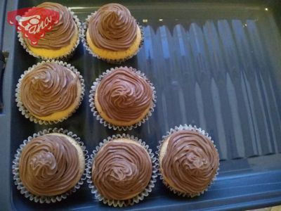 Gluten-free cupcakes with chocolate cream and fruit